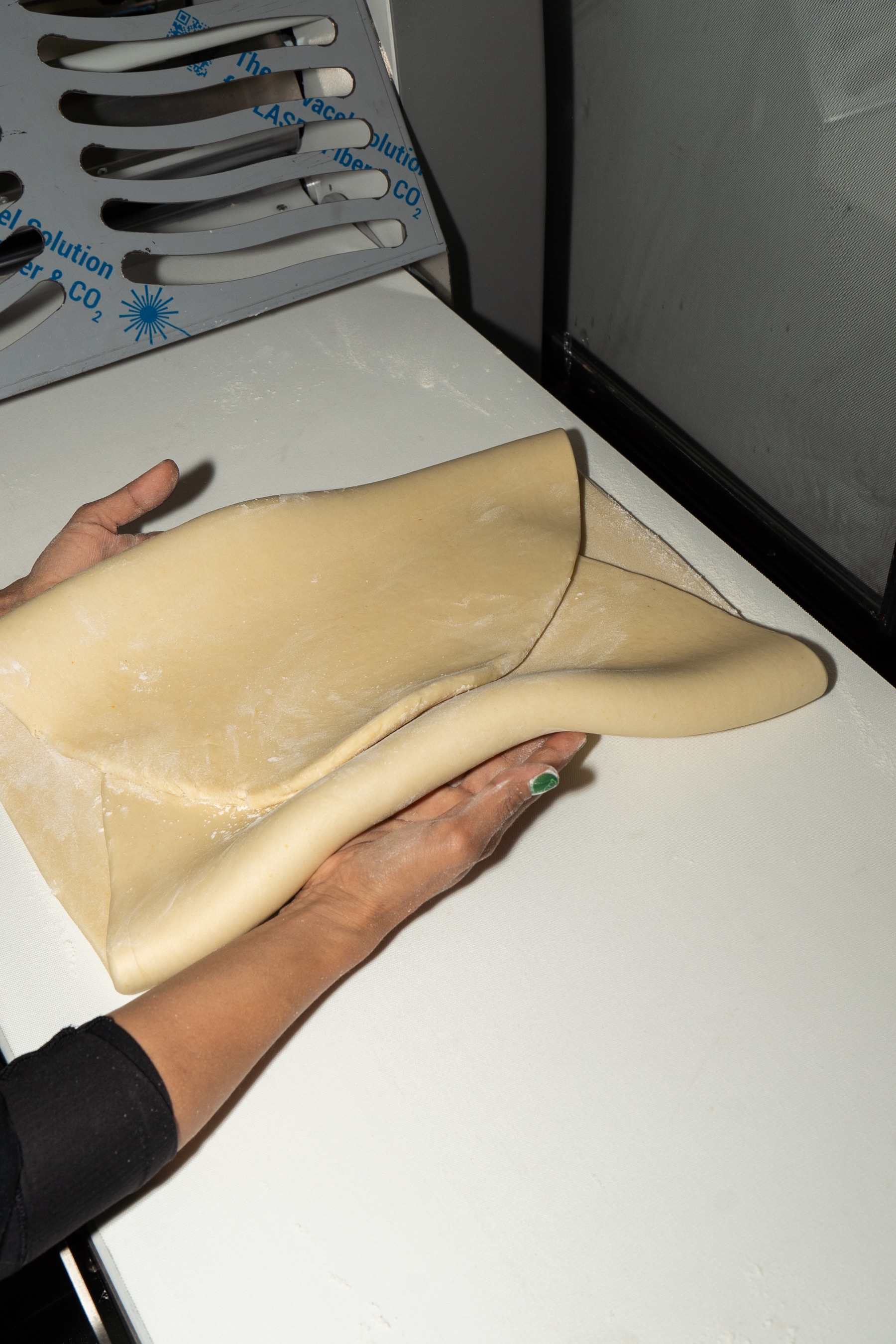 Hands working with pastry dough